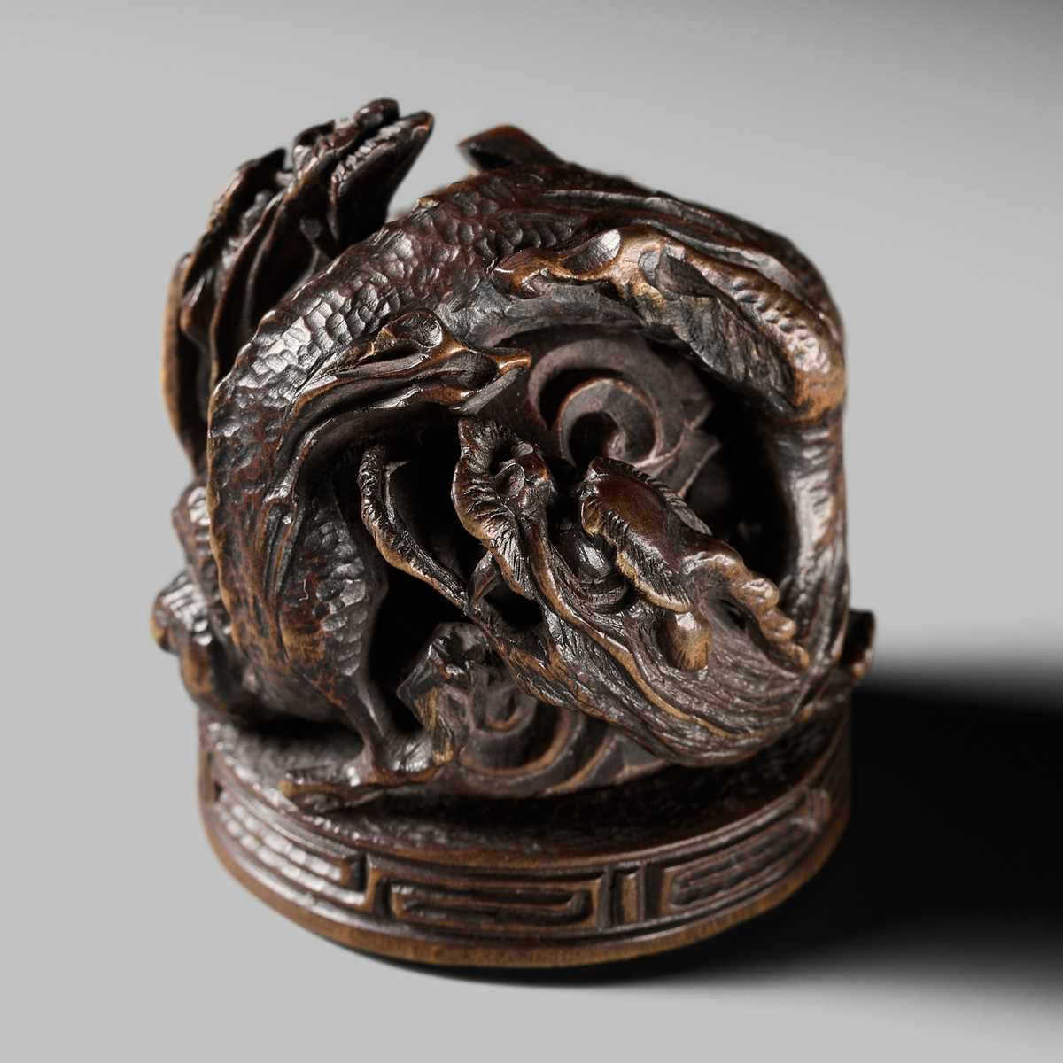 Lot 177 - A FINE OPENWORK WOOD INSHO (SEAL-TYPE) NETSUKE WITH DRAGONS