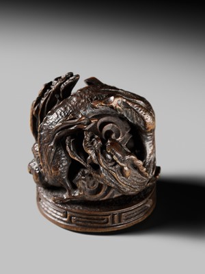 Lot 177 - A FINE OPENWORK WOOD INSHO (SEAL-TYPE) NETSUKE WITH DRAGONS