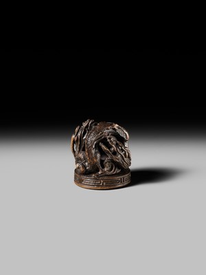 Lot 177 - A FINE OPENWORK WOOD INSHO (SEAL-TYPE) NETSUKE WITH DRAGONS