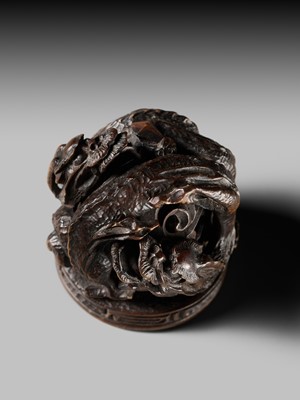 Lot 177 - A FINE OPENWORK WOOD INSHO (SEAL-TYPE) NETSUKE WITH DRAGONS