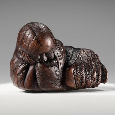 Lot 174 - ICHIUN: A WOOD NETSUKE OF A SLEEPING SHOJO
