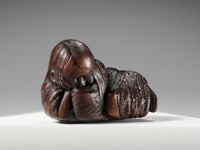 Lot 174 - ICHIUN: A WOOD NETSUKE OF A SLEEPING SHOJO
