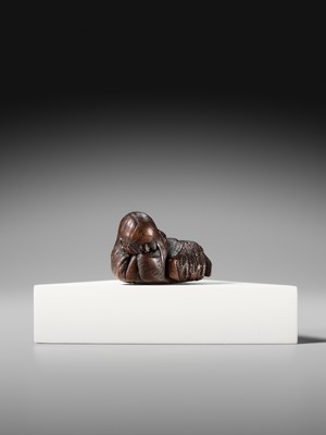 Lot 174 - ICHIUN: A WOOD NETSUKE OF A SLEEPING SHOJO