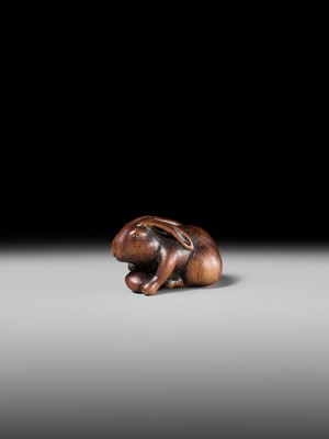Lot 143 - MASATOMO: A RARE WOOD NETSUKE OF A HARE WITH MUSHROOM