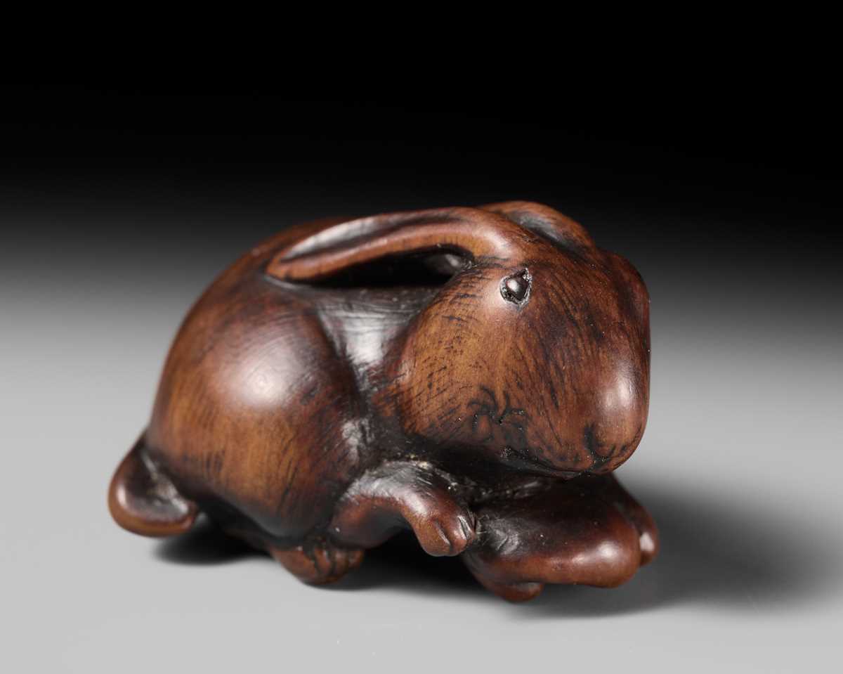 Lot 143 - MASATOMO: A RARE WOOD NETSUKE OF A HARE WITH MUSHROOM
