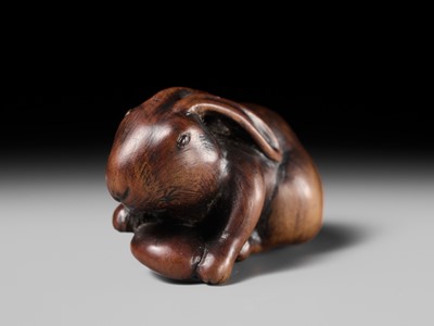 Lot 143 - MASATOMO: A RARE WOOD NETSUKE OF A HARE WITH MUSHROOM