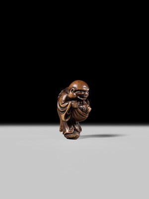 Lot 129 - AN EARLY OSAKA SCHOOL WOOD NETSUKE OF HOTEI AND A KARAKO