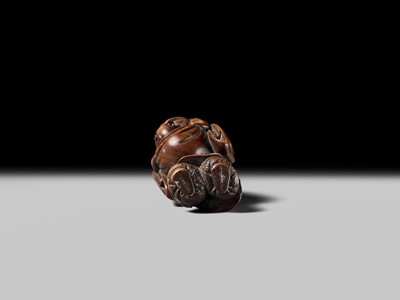 Lot 129 - AN EARLY OSAKA SCHOOL WOOD NETSUKE OF HOTEI AND A KARAKO