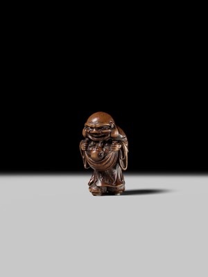Lot 129 - AN EARLY OSAKA SCHOOL WOOD NETSUKE OF HOTEI AND A KARAKO