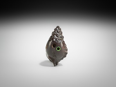 Lot 433 - KOMIN: A DARK WOOD NETSUKE OF A KAPPA EMERGING FROM A CONCH