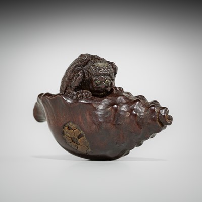 Lot 433 - KOMIN: A DARK WOOD NETSUKE OF A KAPPA EMERGING FROM A CONCH