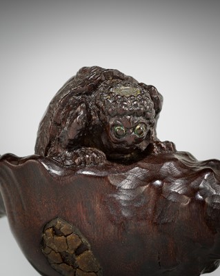 Lot 433 - KOMIN: A DARK WOOD NETSUKE OF A KAPPA EMERGING FROM A CONCH