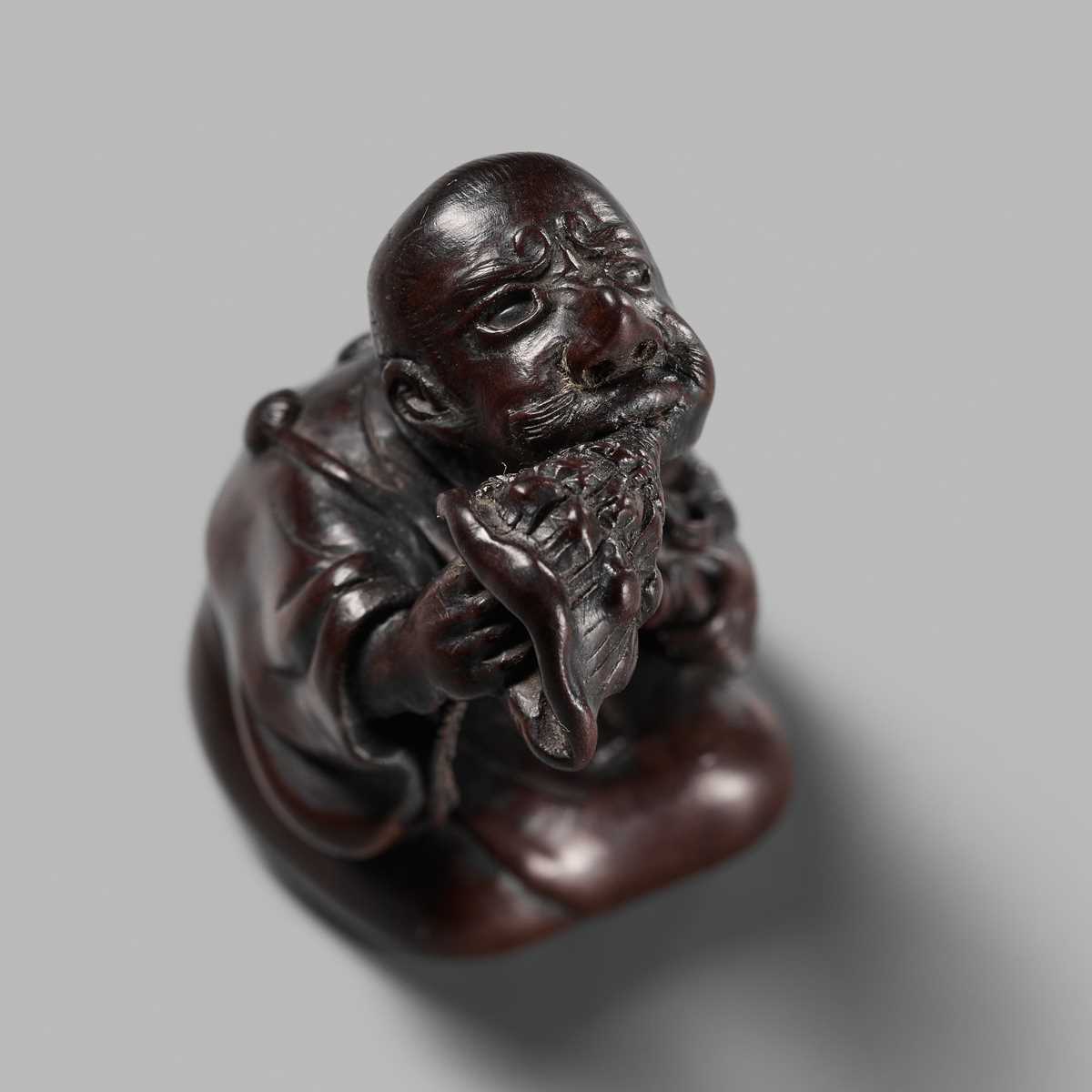 Lot 253 - RAKUMIN: A FINE WOOD NETSUKE OF A YAMABUSHI
