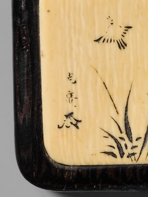 MITSUHIRO: A FINE WOOD AND IVORY MANJU NETSUKE DEPICTING A SPARROW AMONGST BAMBOO
