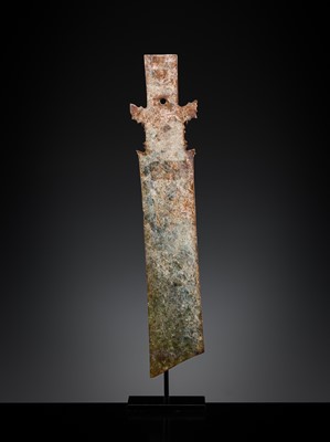 Lot 414 - A CALCIFIED CELADON JADE CEREMONIAL BLADE, ZHANG, WESTERN ZHOU DYNASTY