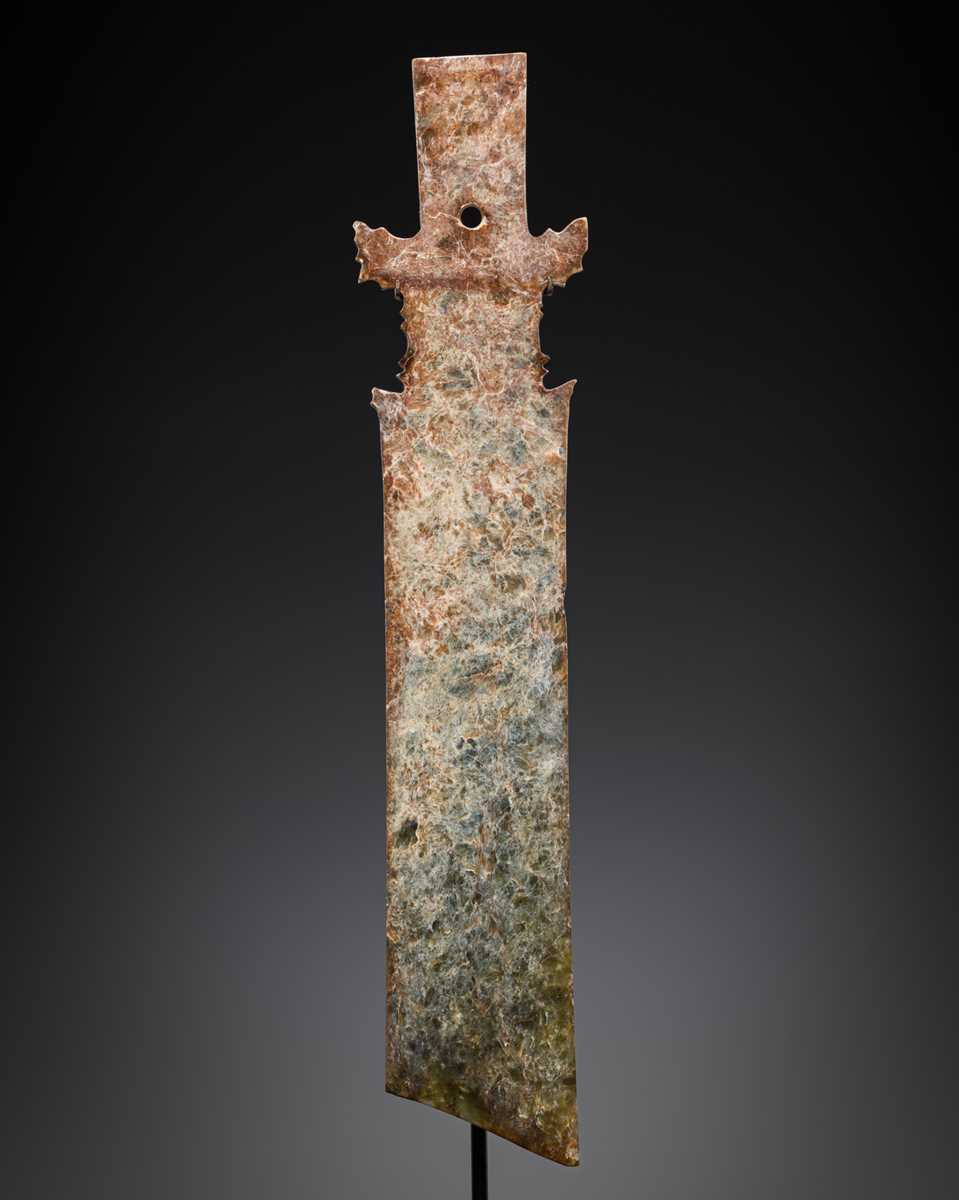 Lot 414 - A CALCIFIED CELADON JADE CEREMONIAL BLADE, ZHANG, WESTERN ZHOU DYNASTY