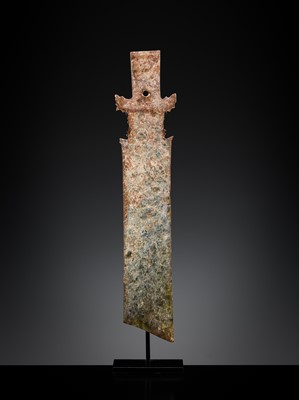 Lot 414 - A CALCIFIED CELADON JADE CEREMONIAL BLADE, ZHANG, WESTERN ZHOU DYNASTY