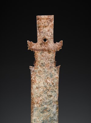 Lot 414 - A CALCIFIED CELADON JADE CEREMONIAL BLADE, ZHANG, WESTERN ZHOU DYNASTY