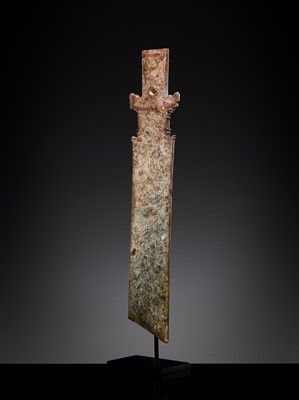 Lot 414 - A CALCIFIED CELADON JADE CEREMONIAL BLADE, ZHANG, WESTERN ZHOU DYNASTY
