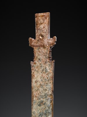 Lot 414 - A CALCIFIED CELADON JADE CEREMONIAL BLADE, ZHANG, WESTERN ZHOU DYNASTY