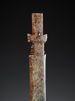 Lot 414 - A CALCIFIED CELADON JADE CEREMONIAL BLADE, ZHANG, WESTERN ZHOU DYNASTY