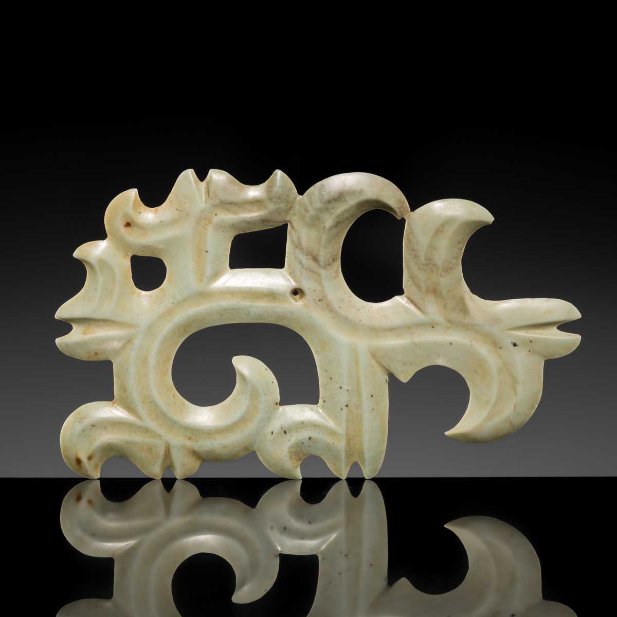 A LARGE PALE GREEN JADE ‘CLOUD-SCROLL’ PENDANT, NEOLITHIC PERIOD, HONGSHAN CULTURE