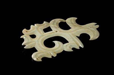 A LARGE PALE GREEN JADE ‘CLOUD-SCROLL’ PENDANT, NEOLITHIC PERIOD, HONGSHAN CULTURE