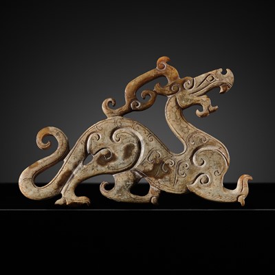 Lot 120 - A RARE CELADON JADE CARVING OF A DRAGON, WARRING STATES PERIOD