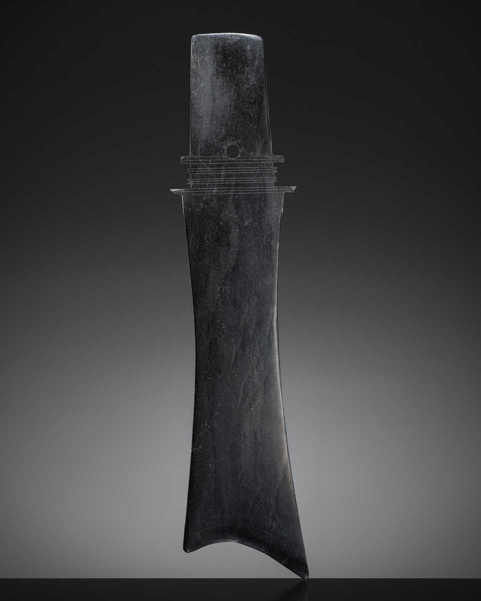 Lot 415 - A BLACK JADE CEREMONIAL BLADE, ZHANG, WESTERN ZHOU DYNASTY