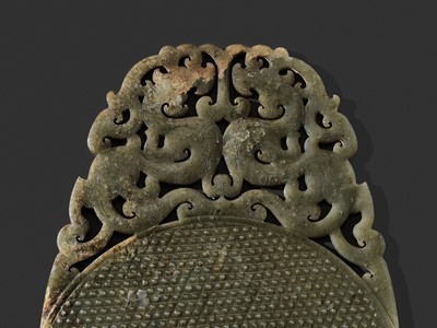 Lot 124 - AN EXCEPTIONALLY RARE AND LARGE DARK GREEN JADE ‘CHILONG’ DISK, ROYAL BI, HAN DYNASTY