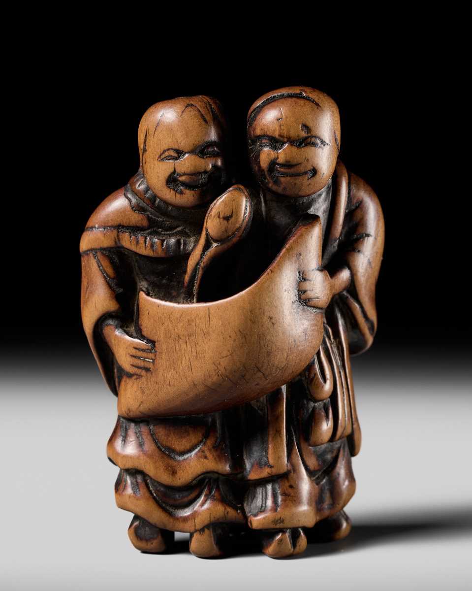 Lot 98 - AN EARLY WOOD NETSUKE OF KANZAN AND JITTOKU