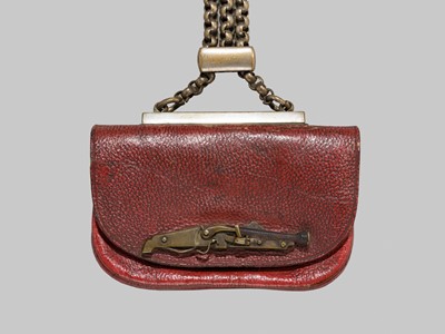 A RARE LEATHER TABAKO-IRE (TOBACCO POUCH) WITH A TANEGASHIMA TEPPO KANAMONO (POUCH CLASP)