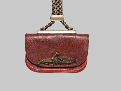 A RARE LEATHER TABAKO-IRE (TOBACCO POUCH) WITH A TANEGASHIMA TEPPO KANAMONO (POUCH CLASP)