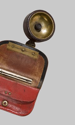 A RARE LEATHER TABAKO-IRE (TOBACCO POUCH) WITH A TANEGASHIMA TEPPO KANAMONO (POUCH CLASP)