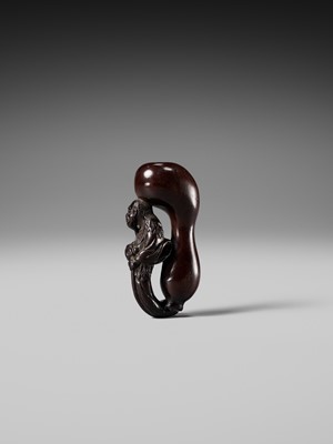 AN UNUSUAL WOOD NETSUKE OF TEKKAI SENNIN EMERGING FROM A HYOTAN (DOUBLE GOURD)