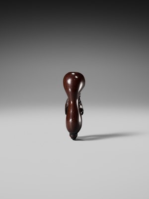 AN UNUSUAL WOOD NETSUKE OF TEKKAI SENNIN EMERGING FROM A HYOTAN (DOUBLE GOURD)