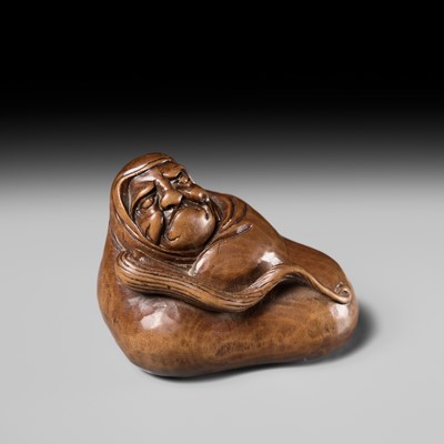 Lot 241 - NOBUSHIGE: A FINE AND RARE WOOD NETSUKE OF DARUMA DISTURBED IN HIS MEDITATION