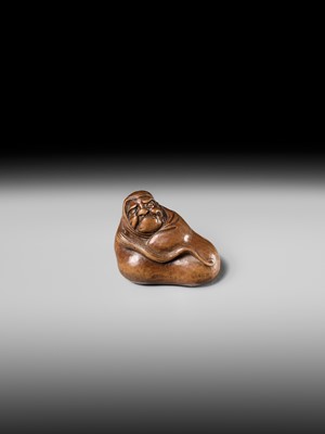 Lot 241 - NOBUSHIGE: A FINE AND RARE WOOD NETSUKE OF DARUMA DISTURBED IN HIS MEDITATION