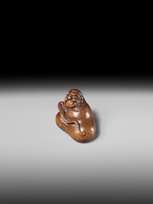 Lot 241 - NOBUSHIGE: A FINE AND RARE WOOD NETSUKE OF DARUMA DISTURBED IN HIS MEDITATION