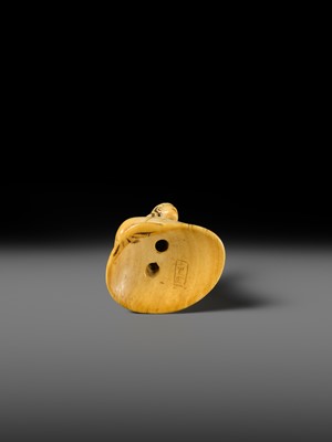 AN IVORY NETSUKE OF A FISHERGIRL (AMA) ON A LARGE CLAM