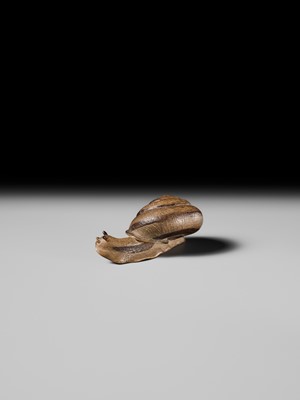 Lot 185 - YUZAN: AN UNUSUAL WOOD NETSUKE OF A SNAIL EMERGING FROM ITS SHELL