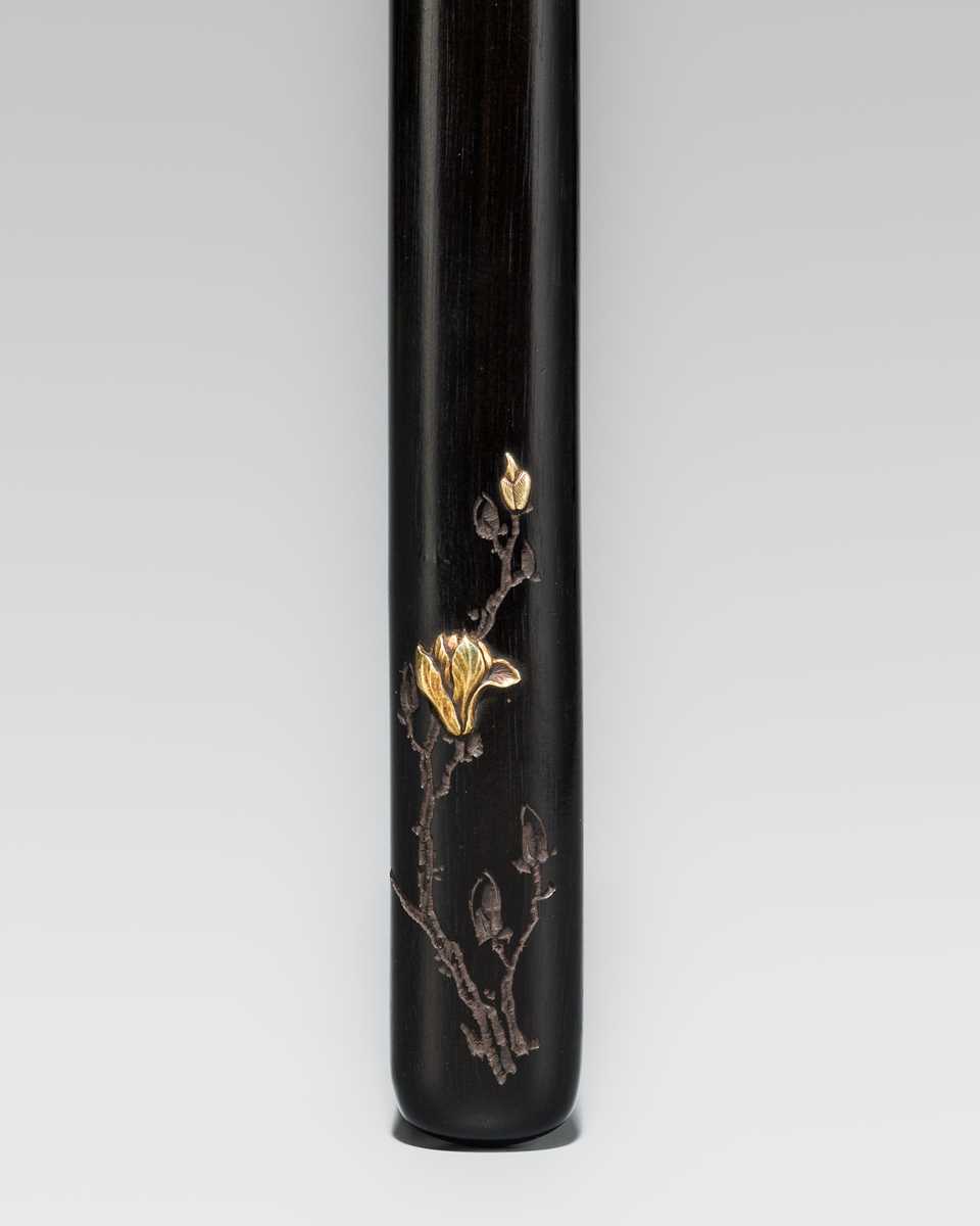 KAITO: A FINE GOLD-INLAID EBONY WOOD KISERUZUTSU (PIPE CASE) WITH MAGNOLIA