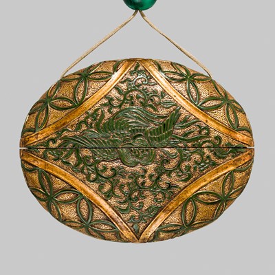 Lot 61 - A RARE LACQUERED ‘SIMULATED EUROPEAN LEATHER’ TONKOTSU WITH A HO-O