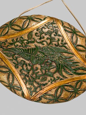 Lot 61 - A RARE LACQUERED ‘SIMULATED EUROPEAN LEATHER’ TONKOTSU WITH A HO-O