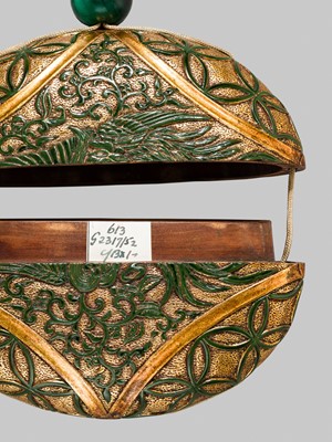 Lot 61 - A RARE LACQUERED ‘SIMULATED EUROPEAN LEATHER’ TONKOTSU WITH A HO-O