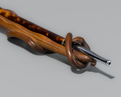 Lot 69 - A FINE WOOD KISERUZUTSU (PIPE CASE) OF A SNAKE ENCIRCLING AN EDAMAME BEAN POD, WITH A MATCHING ‘TORTOISESHELL’ KISERU (PIPE)