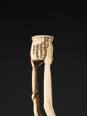 A LARGE AND IMPRESSIVE ANTLER KISERUZUTSU (PIPE CASE) OF TENAGA WITH AN OCTOPUS