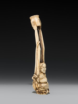 A LARGE AND IMPRESSIVE ANTLER KISERUZUTSU (PIPE CASE) OF TENAGA WITH AN OCTOPUS