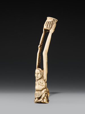 A LARGE AND IMPRESSIVE ANTLER KISERUZUTSU (PIPE CASE) OF TENAGA WITH AN OCTOPUS