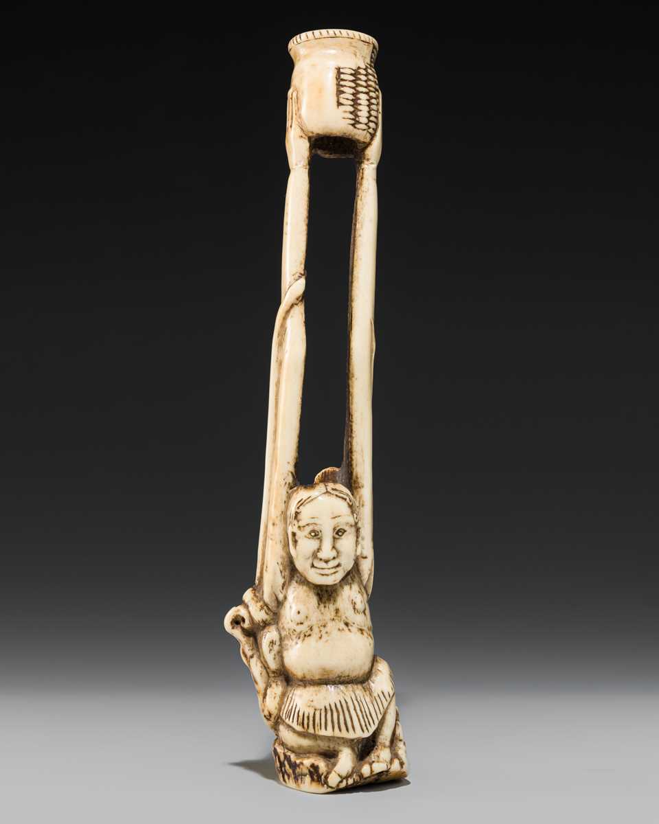 A LARGE AND IMPRESSIVE ANTLER KISERUZUTSU (PIPE CASE) OF TENAGA WITH AN OCTOPUS